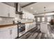 Bright kitchen with stainless appliances, island with sink, breakfast bar, and open floor plan at 706 N Euclid Ave, Indianapolis, IN 46201