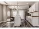 Beautiful updated kitchen with white cabinets, stainless appliances, and stylish pendant lights at 706 N Euclid Ave, Indianapolis, IN 46201