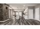 Bright kitchen with stone accent wall, island, stainless appliances, and open floor plan at 706 N Euclid Ave, Indianapolis, IN 46201
