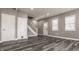 Spacious living room with modern flooring, fresh paint, and large windows, offering a bright and airy feel at 706 N Euclid Ave, Indianapolis, IN 46201