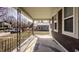 Inviting front porch with decorative railing and ample space for relaxing and enjoying the neighborhood views at 706 N Euclid Ave, Indianapolis, IN 46201