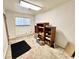 Functional basement space with built-in shelving and carpeted flooring, ready for customization at 75 S 11Th Ave, Beech Grove, IN 46107