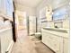 Vintage bathroom with a green toilet and a view to an adjoining bedroom at 75 S 11Th Ave, Beech Grove, IN 46107