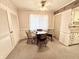 Cozy dining area with a wooden table and chairs next to the kitchen at 75 S 11Th Ave, Beech Grove, IN 46107