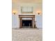 Close-up view of the ornate fireplace with decorative detailing and classic design at 75 S 11Th Ave, Beech Grove, IN 46107