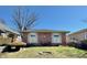 Attractive brick home showcasing a neat front yard and inviting facade under a clear blue sky at 75 S 11Th Ave, Beech Grove, IN 46107
