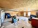 Functional garage featuring plywood walls, concrete flooring, overhead lighting and storage options at 75 S 11Th Ave, Beech Grove, IN 46107