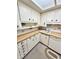 Bright kitchen with wooden countertops, white cabinets and appliances at 75 S 11Th Ave, Beech Grove, IN 46107