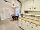 View of a combined kitchen and dining area with wooden cabinets and floors at 75 S 11Th Ave, Beech Grove, IN 46107