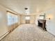 Bright living room featuring a fireplace, carpeted floors, and plenty of natural light at 75 S 11Th Ave, Beech Grove, IN 46107