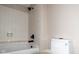 Bathroom features a shower-tub combination, modern fixtures and a white toilet offering a functional space at 7837 Hunters Path, Indianapolis, IN 46214