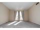 Bright bedroom features neutral walls, carpet, and curtains, creating an inviting, sun-drenched living area at 7837 Hunters Path, Indianapolis, IN 46214