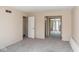 Spacious bedroom with neutral walls, carpet, and sliding closet doors provides a serene atmosphere at 7837 Hunters Path, Indianapolis, IN 46214