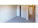 Bedroom with neutral walls, carpet, and a closet with bifold doors provides functional storage space at 7837 Hunters Path, Indianapolis, IN 46214