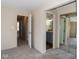 Bedroom view features connecting hallway and adjacent bathroom with vanity and mirror at 7837 Hunters Path, Indianapolis, IN 46214