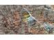 Aerial view highlighting a secluded property with a circular driveway and verdant surroundings at 7899 S Timber Cliff Ln, Trafalgar, IN 46181