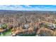 Overhead aerial image of residences along a lakefront with docks, showcasing waterfront living at 7899 S Timber Cliff Ln, Trafalgar, IN 46181