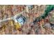 Overhead aerial view of home surrounded by trees, revealing rooftop details and outdoor features at 7899 S Timber Cliff Ln, Trafalgar, IN 46181