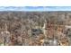 Elevated aerial view displaying a house tucked among trees, blending with the natural setting at 7899 S Timber Cliff Ln, Trafalgar, IN 46181
