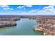 Overhead shot highlights the area lake's beauty with several homes situated around the shoreline at 7899 S Timber Cliff Ln, Trafalgar, IN 46181