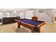 Finished basement with a pool table and comfortable seating area at 7899 S Timber Cliff Ln, Trafalgar, IN 46181