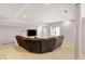 Finished basement with a large sectional sofa and mounted television at 7899 S Timber Cliff Ln, Trafalgar, IN 46181