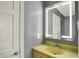 Bathroom featuring a lighted mirror above a sink with storage at 7899 S Timber Cliff Ln, Trafalgar, IN 46181