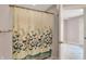 Bathroom with a floral shower curtain and bright, airy ambiance at 7899 S Timber Cliff Ln, Trafalgar, IN 46181