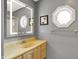 Bathroom with a lighted mirror and an octagonal window above the sink at 7899 S Timber Cliff Ln, Trafalgar, IN 46181