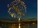 Vibrant fireworks display lighting up the night sky above a body of water, celebrating community at 7899 S Timber Cliff Ln, Trafalgar, IN 46181