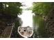 Lake view featuring a dock and boat, ideal for water activities at 7899 S Timber Cliff Ln, Trafalgar, IN 46181
