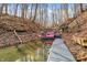 View of the lake, with dock and a boat in the water at 7899 S Timber Cliff Ln, Trafalgar, IN 46181