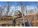 Exterior view of the home, highlighting the setting and multiple decks at 7899 S Timber Cliff Ln, Trafalgar, IN 46181