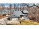 Charming two-story home with stone accents, a two-car garage, and a deck overlooking a tree-filled yard at 7899 S Timber Cliff Ln, Trafalgar, IN 46181