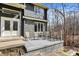 Close up of deck with furniture, stone details, and a double-door entrance with decorative glass at 7899 S Timber Cliff Ln, Trafalgar, IN 46181
