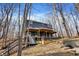 Exterior of lake house featuring multiple decks, stairs, and hot tub with beautiful lake views at 7899 S Timber Cliff Ln, Trafalgar, IN 46181