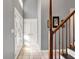 Bright foyer featuring decorative double-door entry and coat closet with white doors and trim at 7899 S Timber Cliff Ln, Trafalgar, IN 46181