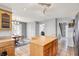 Bright kitchen with island, tile floors, stainless appliances and wood cabinets at 7899 S Timber Cliff Ln, Trafalgar, IN 46181