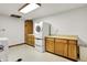 Well-lit laundry room with modern appliances and ample cabinet space at 7899 S Timber Cliff Ln, Trafalgar, IN 46181