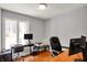 Functional home office space with a monitor, printer, and two desks, perfect for remote work at 7899 S Timber Cliff Ln, Trafalgar, IN 46181