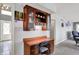 Home office featuring a built-in desk with cabinets and drawers, offering ample storage and workspace at 7899 S Timber Cliff Ln, Trafalgar, IN 46181