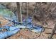 Blue wooden stairway leading down to the lake, with mature tree views at 7899 S Timber Cliff Ln, Trafalgar, IN 46181