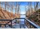 Stunning waterfront view showcasing the lake, dock, and a private retreat at 7899 S Timber Cliff Ln, Trafalgar, IN 46181