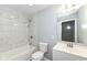 Bathroom featuring modern vanity, tiled shower and bath, and new fixtures at 8026 Roy Rd, Indianapolis, IN 46219