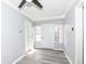 Inviting entryway featuring a clean, neutral palette, a new ceiling fan, and durable vinyl floors at 8026 Roy Rd, Indianapolis, IN 46219