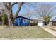 Charming single-story home featuring a blue exterior, well-maintained lawn and inviting curb appeal at 8026 Roy Rd, Indianapolis, IN 46219