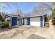 This home features a freshly sealed drive way, an attached garage, and updated exterior paint at 8026 Roy Rd, Indianapolis, IN 46219