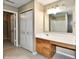 Bathroom featuring a vanity with a sink, white countertop, and a large mirror and cabinets at 8630 Aylesworth Dr, Camby, IN 46113