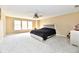 Spacious bedroom with neutral colored walls, carpet, and ceiling fan at 8630 Aylesworth Dr, Camby, IN 46113