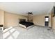 Spacious bedroom with neutral walls, carpet, ceiling fan, and connected room at 8630 Aylesworth Dr, Camby, IN 46113
